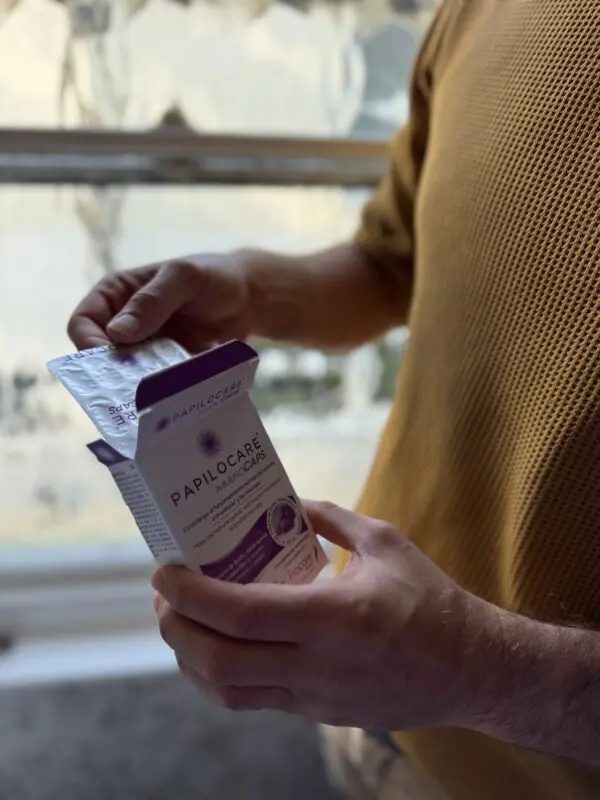 Man using papilocare immunocaps
