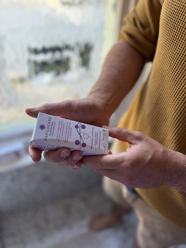 Man holding papilocare external genital gel