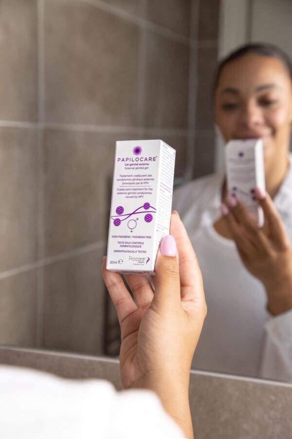 Woman holding Papilocare external genital gel