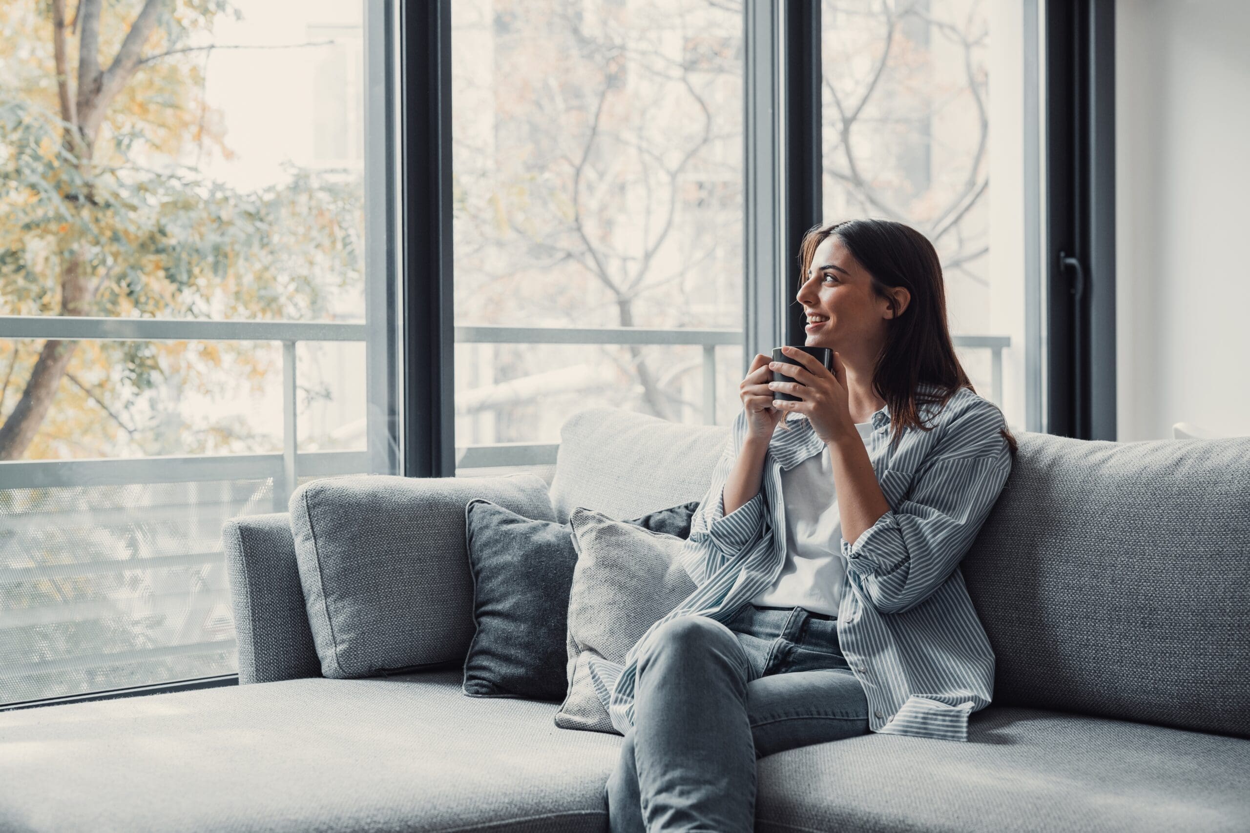 Woman drinking cup of coffee